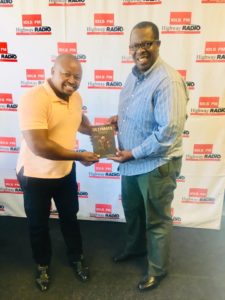 Pastor Mzwa Ngcongo with a copy of The Ultimate Thief